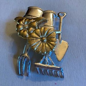 Silver and gold tone garden themed brooch